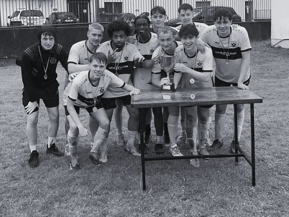 Clowown Rovers gather around the trophy after retaining the title at the 2024 tournament