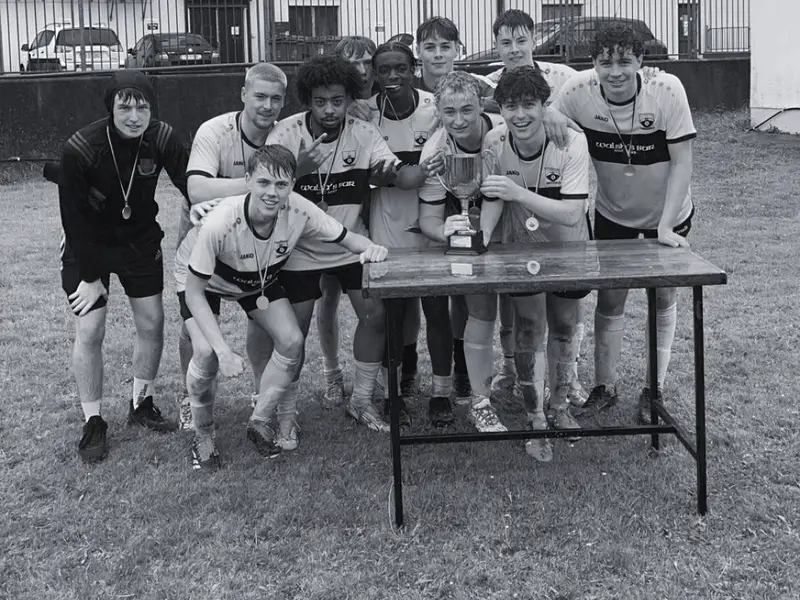 Clowown Rovers with the trophy on the table after winning the 2024 final on penalties